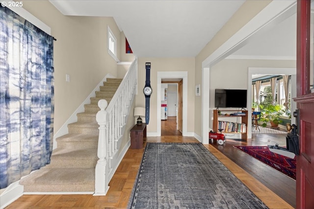 entryway featuring parquet flooring