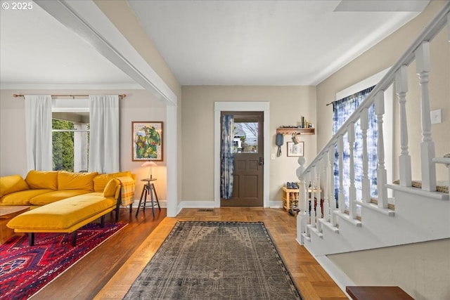 foyer entrance featuring parquet floors