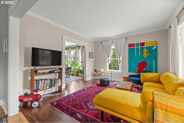 living room with ornamental molding and wood-type flooring