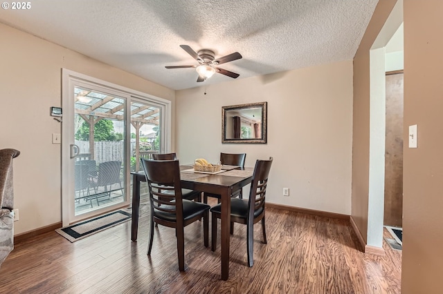 617 NW Fariss Rd, Gresham, OR 97030 - dining area featuring wood finished floors, a ceiling fan, baseboards, and a textured ceiling