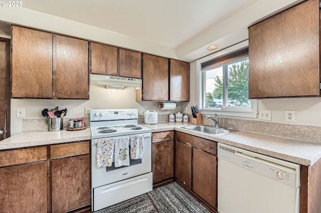 617 NW Fariss Rd, Gresham, OR 97030 - kitchen featuring white appliances, under cabinet range hood, a sink, and light countertops
