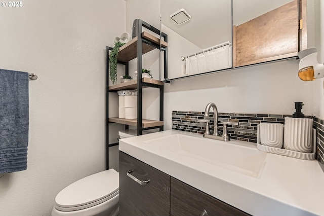 617 NW Fariss Rd, Gresham, OR 97030 - full bathroom featuring backsplash, vanity, and toilet