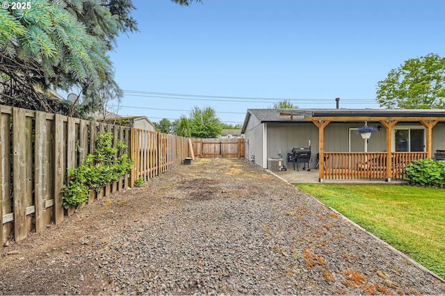 617 NW Fariss Rd, Gresham, OR 97030 - view of side of property with a fenced backyard, a patio area, and cooling unit