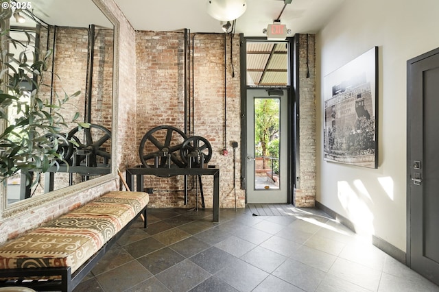 1240 NW Hoyt St Unit 6, Portland, OR 97209 - entrance foyer with brick wall and baseboards