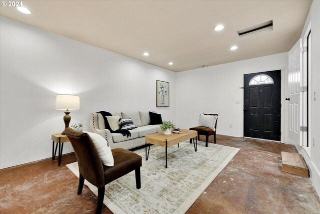 living room with concrete flooring