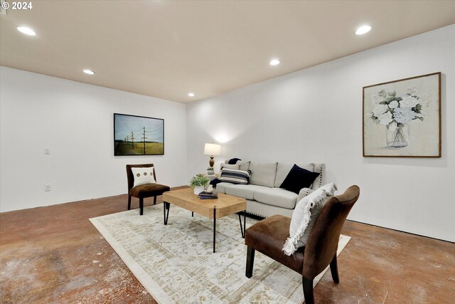 living room featuring concrete flooring