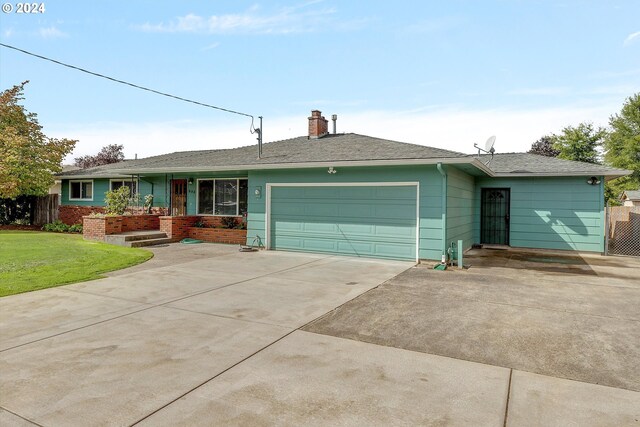 single story home featuring a garage