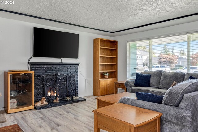 living room featuring hardwood / wood-style floors and a textured ceiling