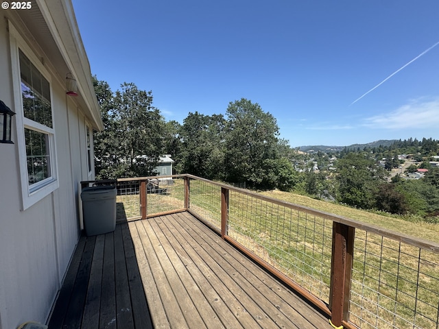 1332 SE Strong Ave, Roseburg, OR 97470 - wooden terrace featuring a lawn, an outdoor structure, and a mountain view