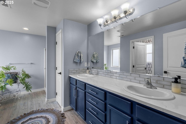 802 NW Green Forest Cir, Redmond, OR 97756 - bathroom featuring double vanity and wood finished floors