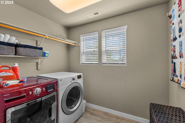 802 NW Green Forest Cir, Redmond, OR 97756 - washroom with separate washer and dryer and light wood-style floors