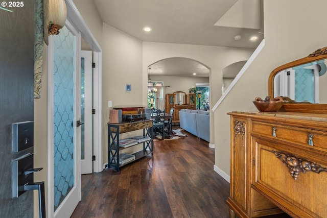 802 NW Green Forest Cir, Redmond, OR 97756 - entrance foyer featuring arched walkways, dark wood-style flooring, and recessed lighting