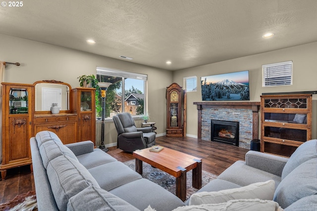 802 NW Green Forest Cir, Redmond, OR 97756 - living room with recessed lighting, wood finished floors, a fireplace, and a textured ceiling
