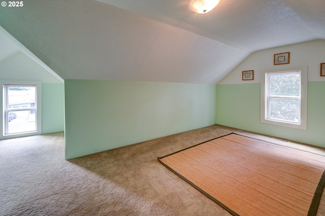 589 NW 3rd Ave, Canby, OR 97013 - bonus room featuring vaulted ceiling, carpet floors, and a textured ceiling