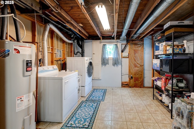 589 NW 3rd Ave, Canby, OR 97013 - laundry area featuring water heater, washer and clothes dryer, and light floors