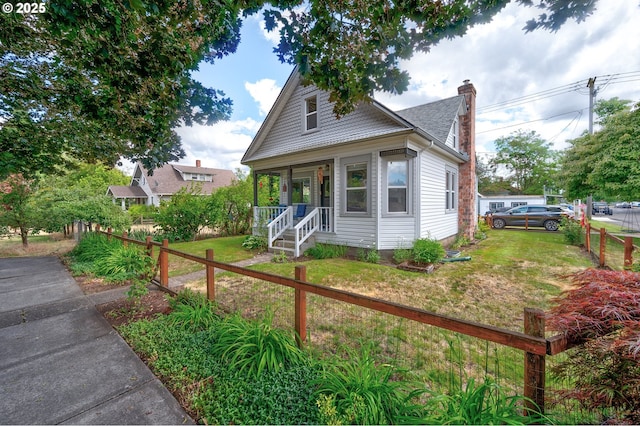 589 NW 3rd Ave, Canby, OR 97013 - bungalow-style home featuring a chimney and a porch