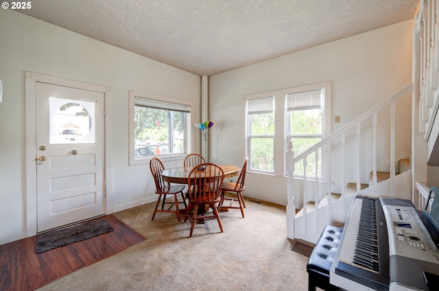 589 NW 3rd Ave, Canby, OR 97013 - carpeted dining space with stairway and a textured ceiling