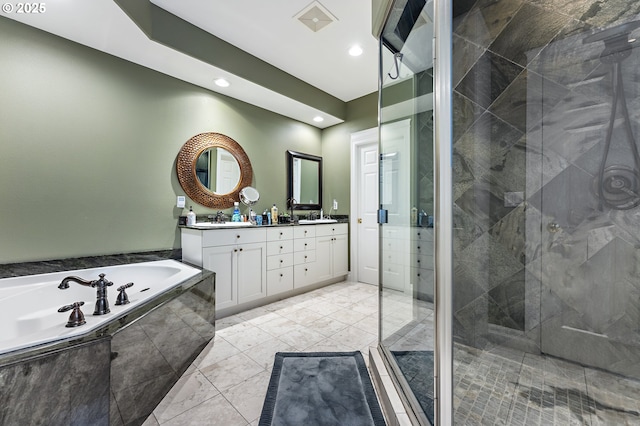 bathroom featuring vanity and plus walk in shower