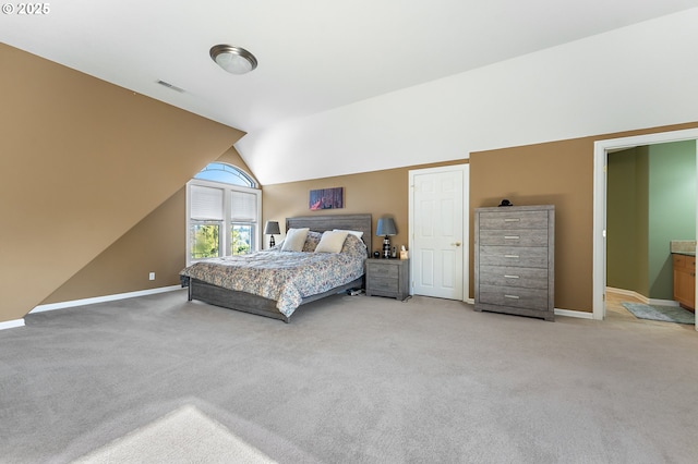 bedroom featuring carpet and lofted ceiling