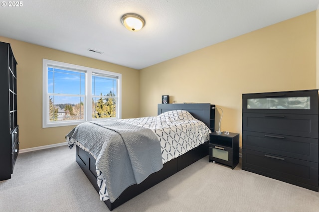 bedroom with light carpet