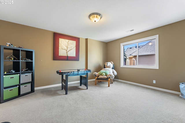 recreation room with carpet flooring