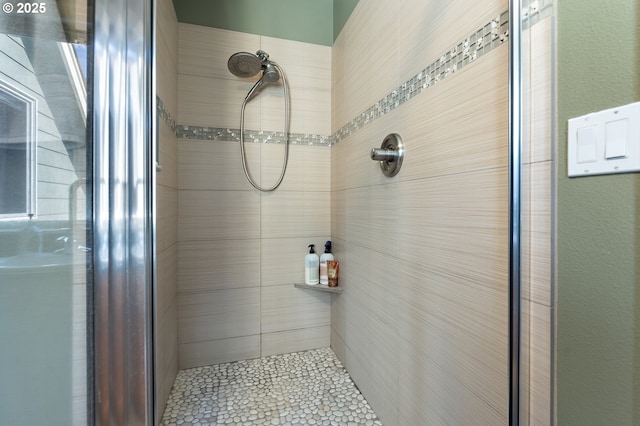 bathroom featuring an enclosed shower