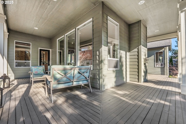 wooden terrace featuring an outdoor hangout area