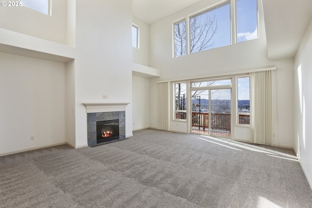 1455 NE Cooper Ln, Estacada, OR 97023 - unfurnished living room with baseboards, carpet floors, and a tile fireplace
