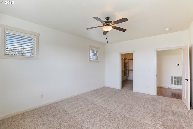 1455 NE Cooper Ln, Estacada, OR 97023 - unfurnished bedroom with multiple windows, visible vents, a spacious closet, and carpet flooring