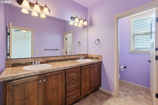 1455 NE Cooper Ln, Estacada, OR 97023 - bathroom featuring decorative backsplash, double vanity, and a sink