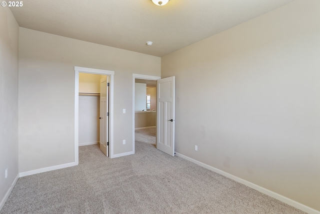1455 NE Cooper Ln, Estacada, OR 97023 - unfurnished bedroom featuring baseboards, a closet, carpet floors, and a spacious closet
