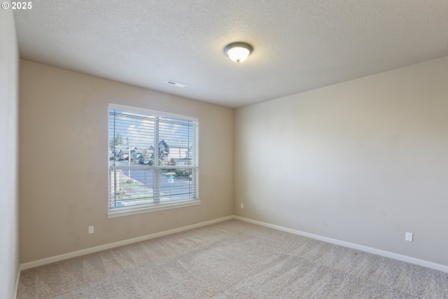 1455 NE Cooper Ln, Estacada, OR 97023 - carpeted empty room featuring baseboards, a textured ceiling, and visible vents