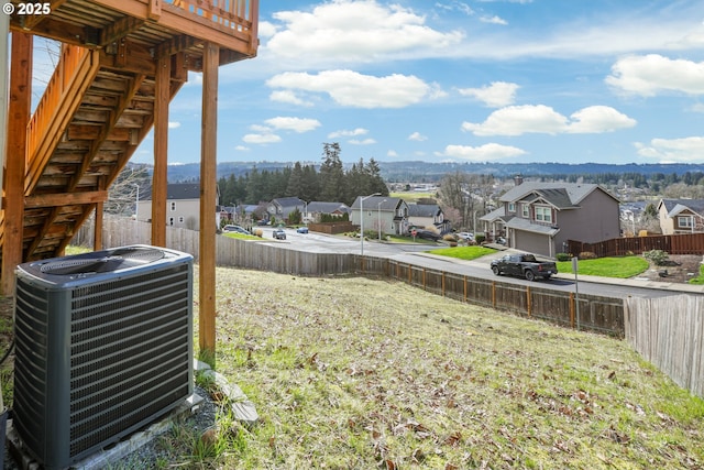 1455 NE Cooper Ln, Estacada, OR 97023 - view of yard featuring central air condition unit, fence, and a residential view