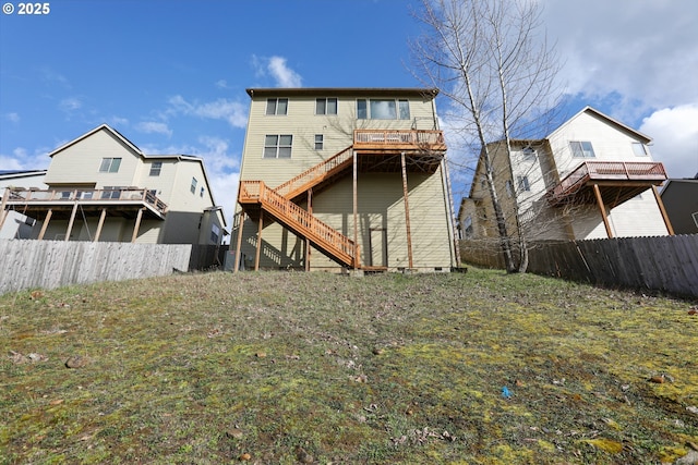1455 NE Cooper Ln, Estacada, OR 97023 - back of house with a deck, fence, and stairway