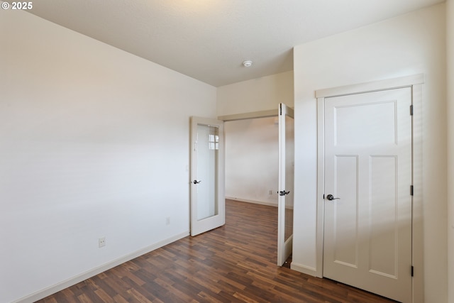1455 NE Cooper Ln, Estacada, OR 97023 - unfurnished bedroom featuring dark wood-type flooring and baseboards