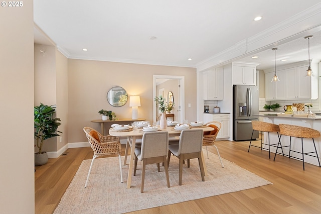 4926 NE 12th Ave, Portland, OR 97211 - dining space featuring light wood-style flooring, recessed lighting, ornamental molding, and baseboards