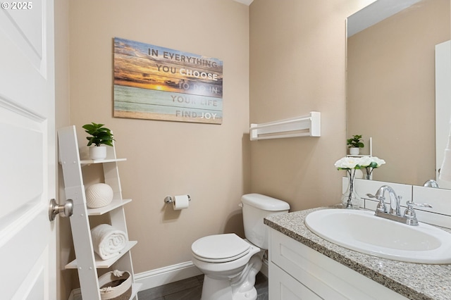 4926 NE 12th Ave, Portland, OR 97211 - half bathroom featuring toilet, vanity, and baseboards