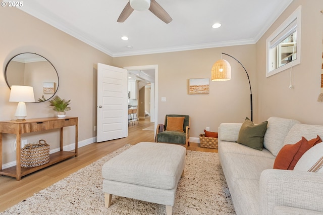 4926 NE 12th Ave, Portland, OR 97211 - living room with crown molding, light wood finished floors, ceiling fan, recessed lighting, and baseboards