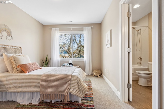 4926 NE 12th Ave, Portland, OR 97211 - carpeted bedroom featuring ensuite bath and baseboards
