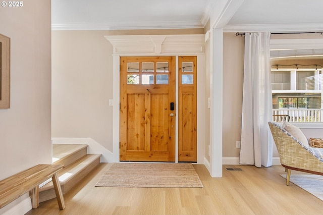 4926 NE 12th Ave, Portland, OR 97211 - entrance foyer featuring wood finished floors, crown molding, plenty of natural light, baseboards, and stairs
