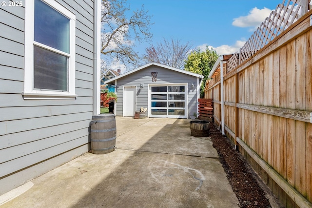 4926 NE 12th Ave, Portland, OR 97211 - view of patio with an outbuilding and a garage