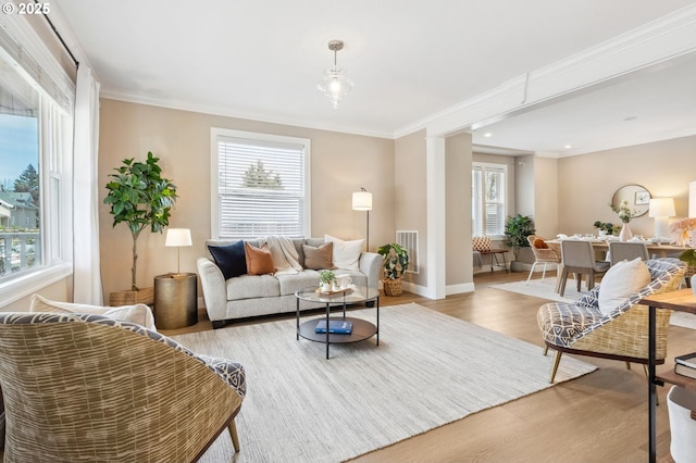 4926 NE 12th Ave, Portland, OR 97211 - living area featuring light wood finished floors, ornamental molding, baseboards, and recessed lighting