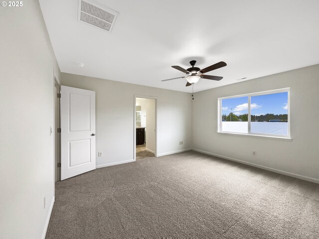 10095 NW Curtis St, North Plains, OR 97133 - unfurnished bedroom featuring carpet floors, baseboards, ceiling fan, and connected bathroom