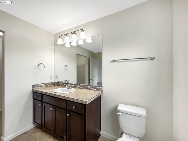 10095 NW Curtis St, North Plains, OR 97133 - bathroom featuring baseboards, vanity, toilet, and tile patterned floors
