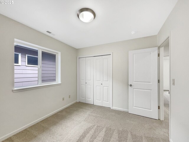10095 NW Curtis St, North Plains, OR 97133 - unfurnished bedroom with carpet flooring, baseboards, and a closet