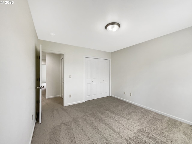 10095 NW Curtis St, North Plains, OR 97133 - unfurnished bedroom with baseboards, carpet flooring, and a closet