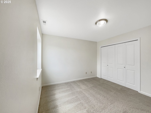 10095 NW Curtis St, North Plains, OR 97133 - unfurnished bedroom with baseboards, carpet flooring, and a closet
