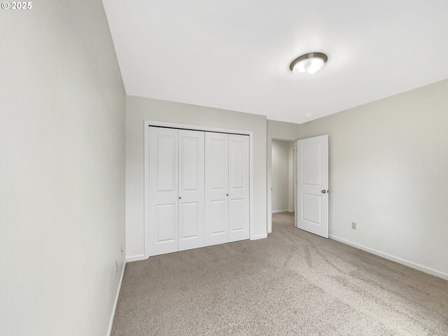 10095 NW Curtis St, North Plains, OR 97133 - unfurnished bedroom featuring carpet, baseboards, and a closet