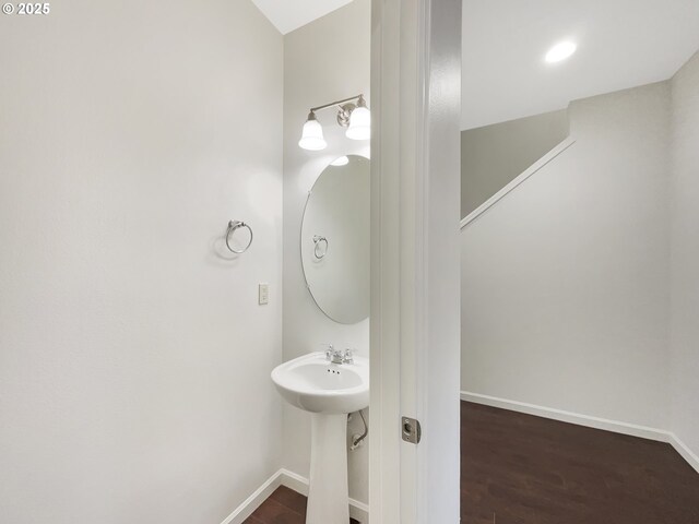 10095 NW Curtis St, North Plains, OR 97133 - bathroom with baseboards, wood finished floors, and a sink