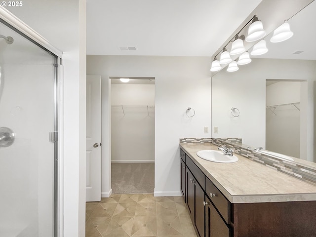 10095 NW Curtis St, North Plains, OR 97133 - full bath featuring a shower stall, a spacious closet, vanity, and baseboards